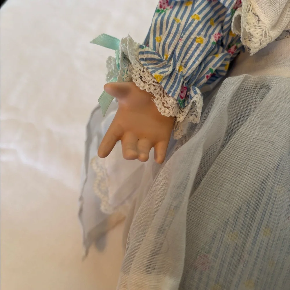 Charming Blue and White Porcelain Doll with Curly Hair - Picture 9 of 11